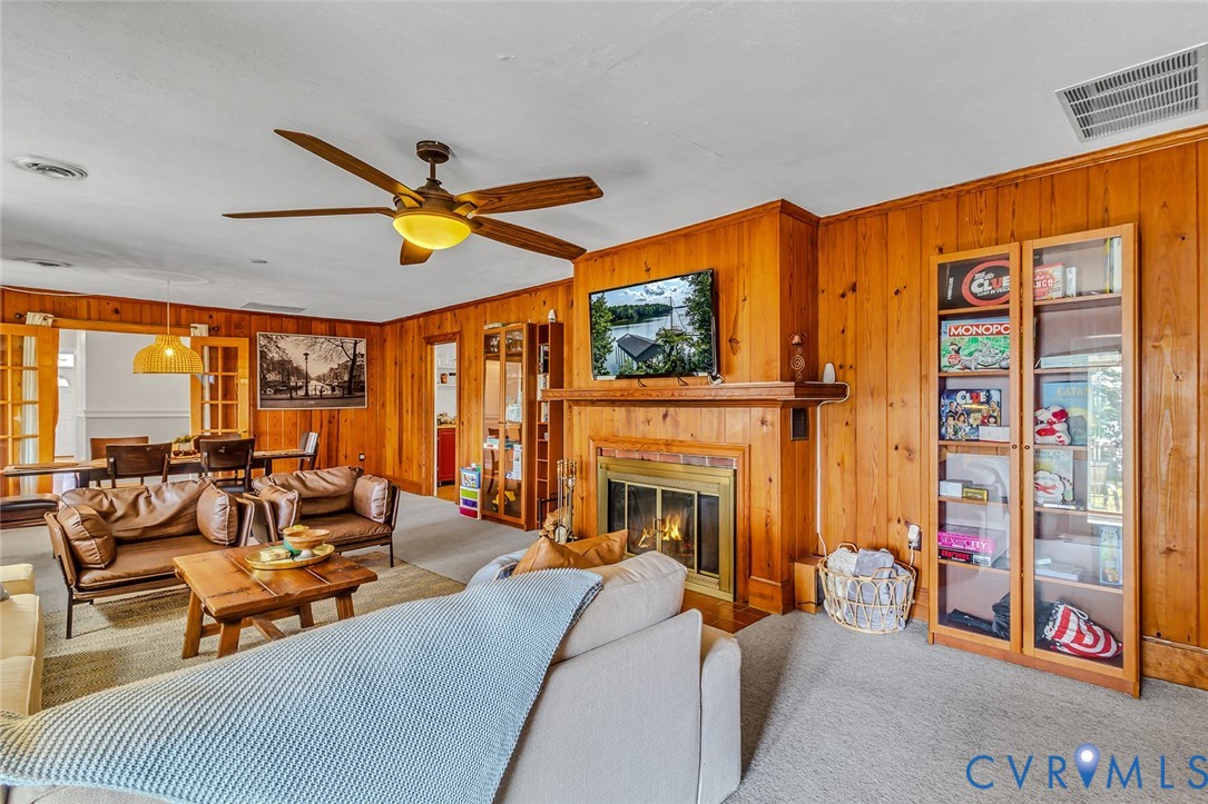 437 Plainview Road Kinsale, VA 22488 - Photo 20 of 50 a living room with furniture a fireplace and a large window