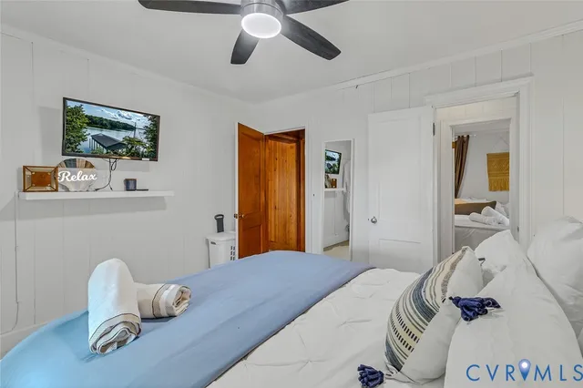 a bathroom with a sink a toilet and shower curtain