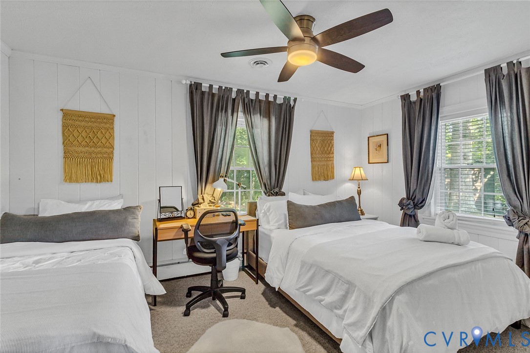437 Plainview Road Kinsale, VA 22488 - Photo 26 of 50 a bedroom with a bed a computer on desk and a dresser next to a window