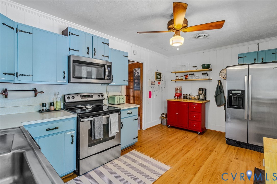 437 Plainview Road Kinsale, VA 22488 - Photo 28 of 50 a kitchen with stainless steel appliances granite countertop a refrigerator a stove top oven a sink and dishwasher