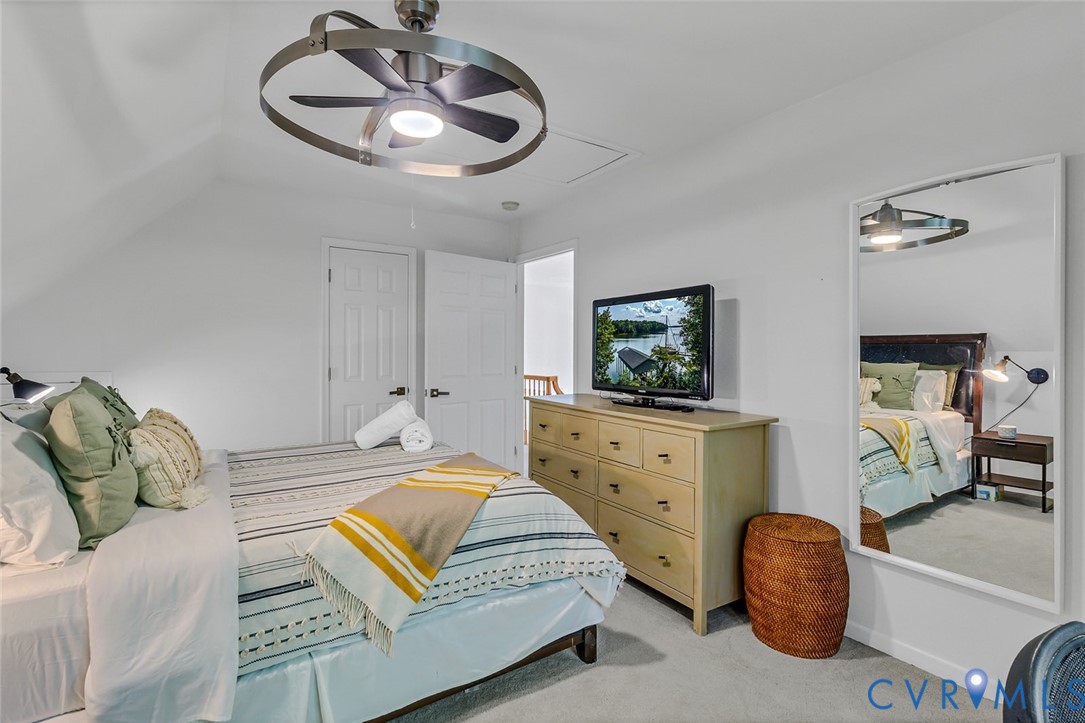 437 Plainview Road Kinsale, VA 22488 - Photo 33 of 50 a bedroom with a bed and a chandelier