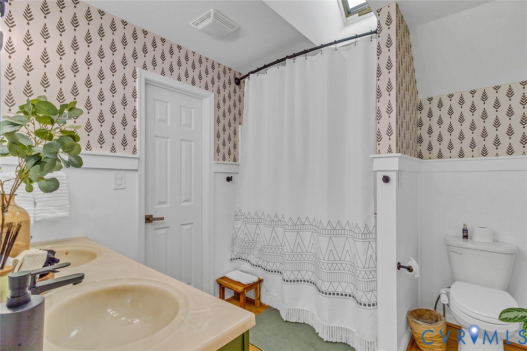 437 Plainview Road Kinsale, VA 22488 - Photo 34 of 50 a bathroom with a sink a toilet and shower curtain