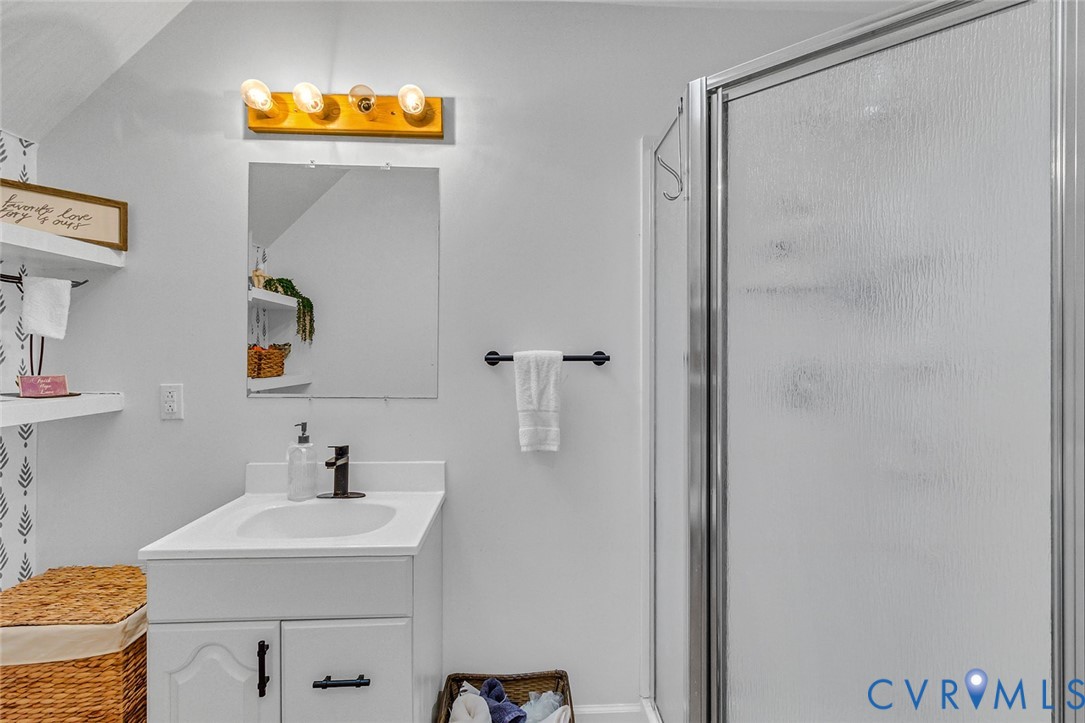 437 Plainview Road Kinsale, VA 22488 - Photo 35 of 50 a bathroom with a sink and a mirror