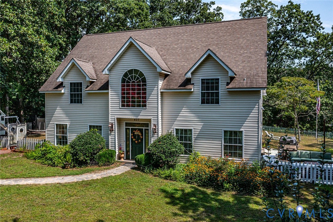 437 Plainview Road Kinsale, VA 22488 - Photo 46 of 50 a front view of a house with a yard and potted plants