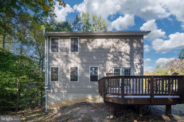 a view of a balcony with wooden fence