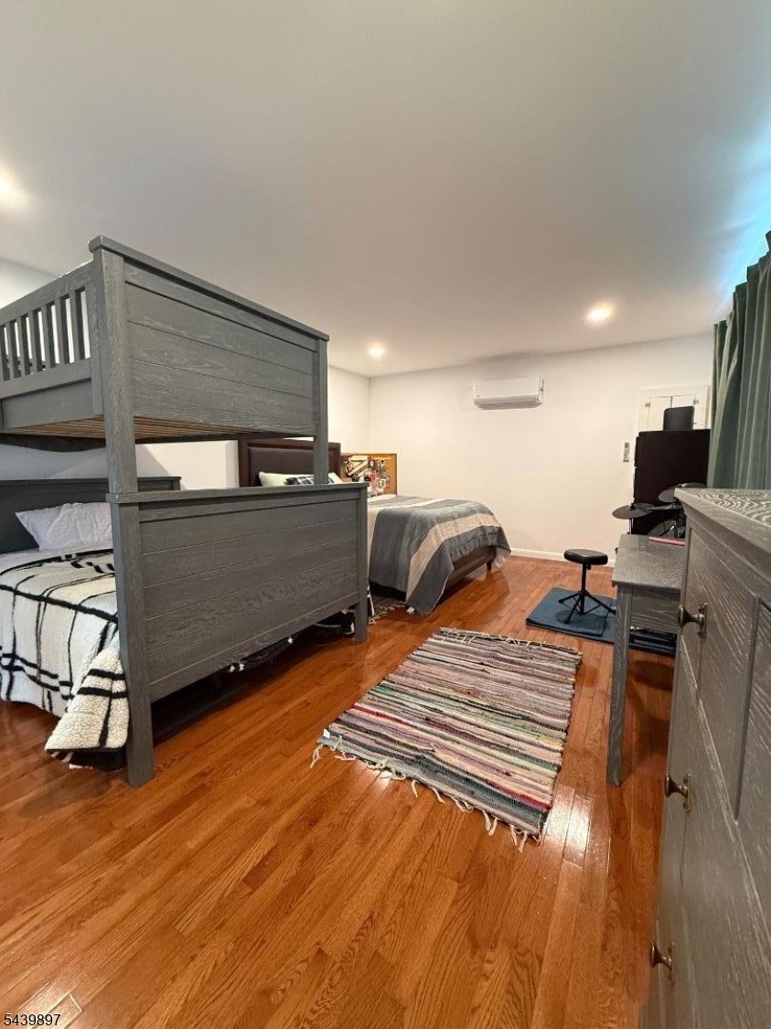 22 Karen Road Vernon, NJ 07422 - Photo 6 of 26 a bedroom with furniture and a wooden floor