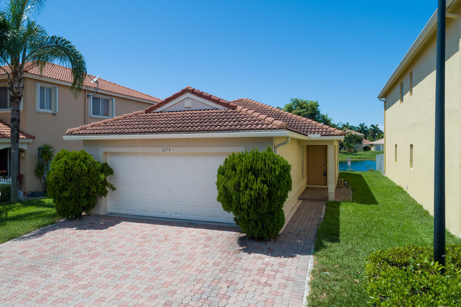 1079 Big Torch Street Riviera Beach, FL 33407 - Photo 1 of 31 Front photo