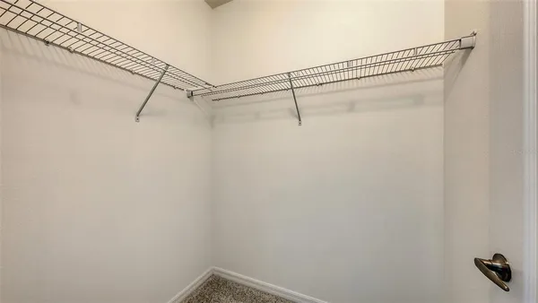 a view of a room with racks on the wall