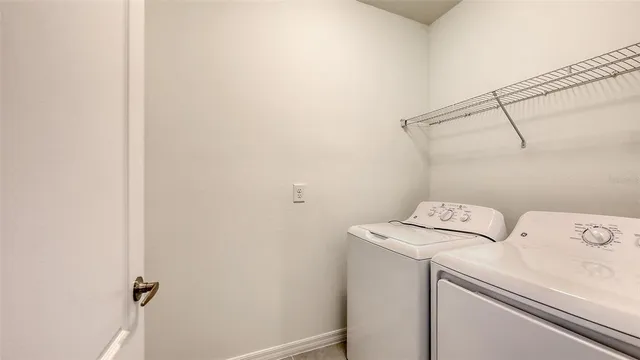 a utility room with dryer and washer