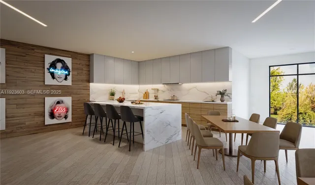 a dinning room with furniture and wooden floor