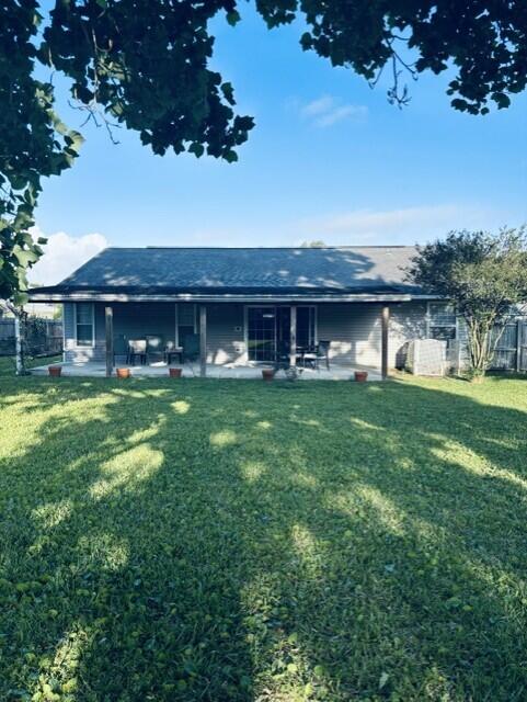 402 Juniper Street Destin, FL 32541 - Photo 18 of 20 a front view of a house with garden