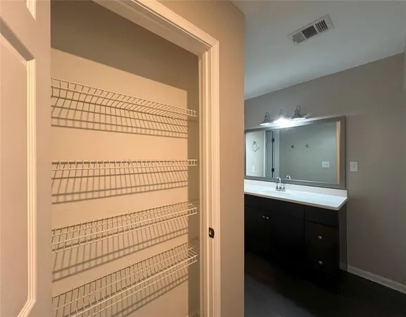 a bathroom with a shower and a sink