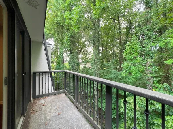 a view of balcony with yard