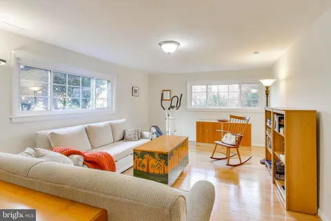 a living room with furniture and a table