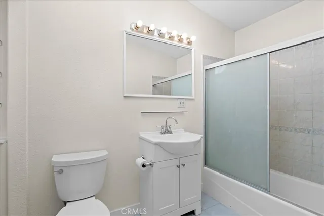 a bathroom with a toilet a sink and a bathtub