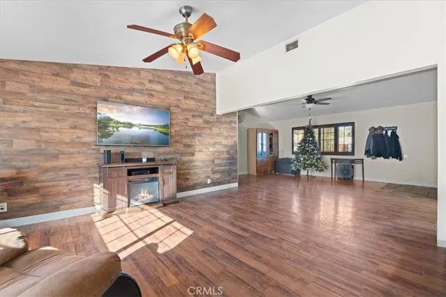 a view of livingroom with furniture and flat screen tv
