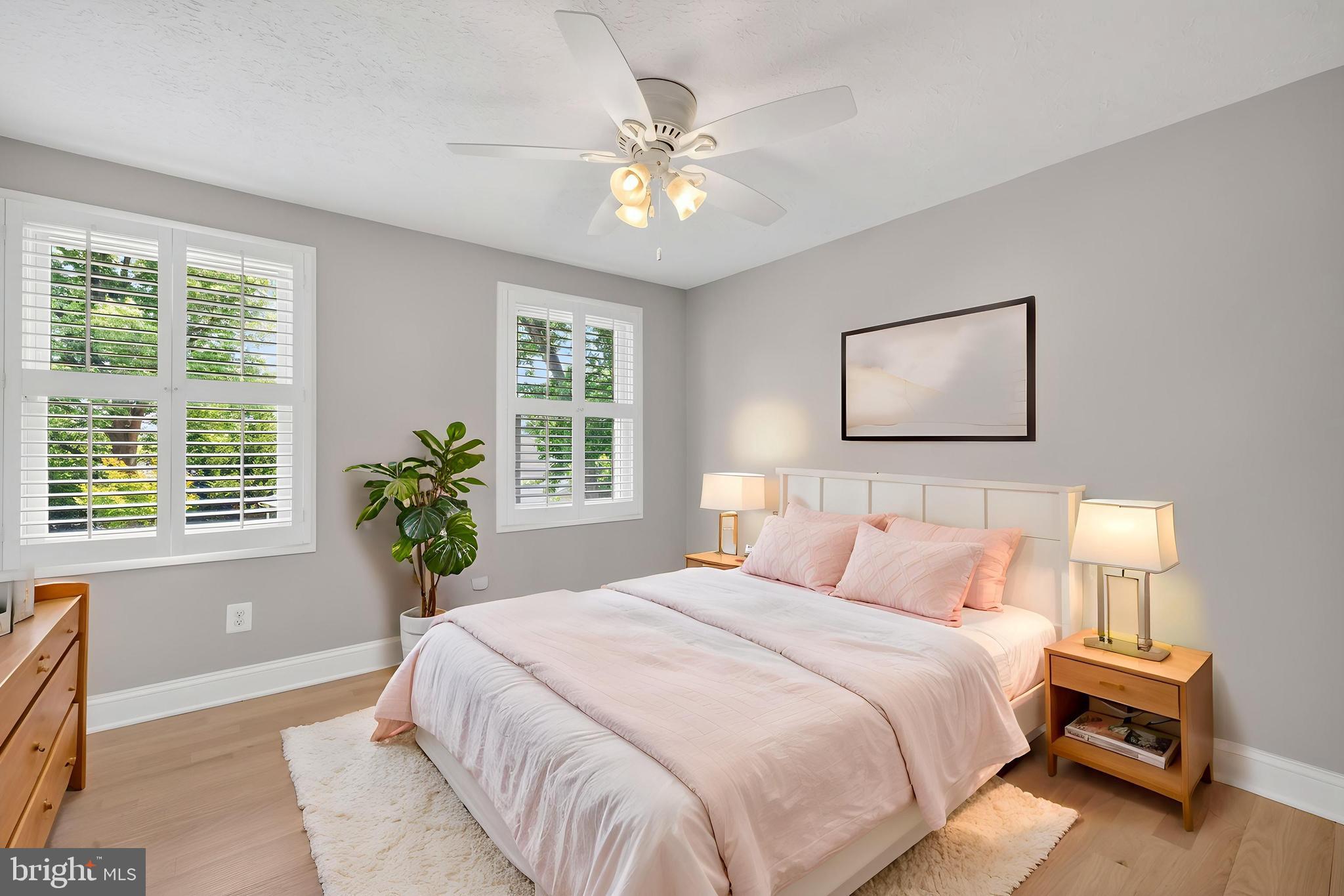 7518 Candytuft Court Springfield, VA 22153 - Photo 27 of 47 a bedroom with a large bed and a chandelier