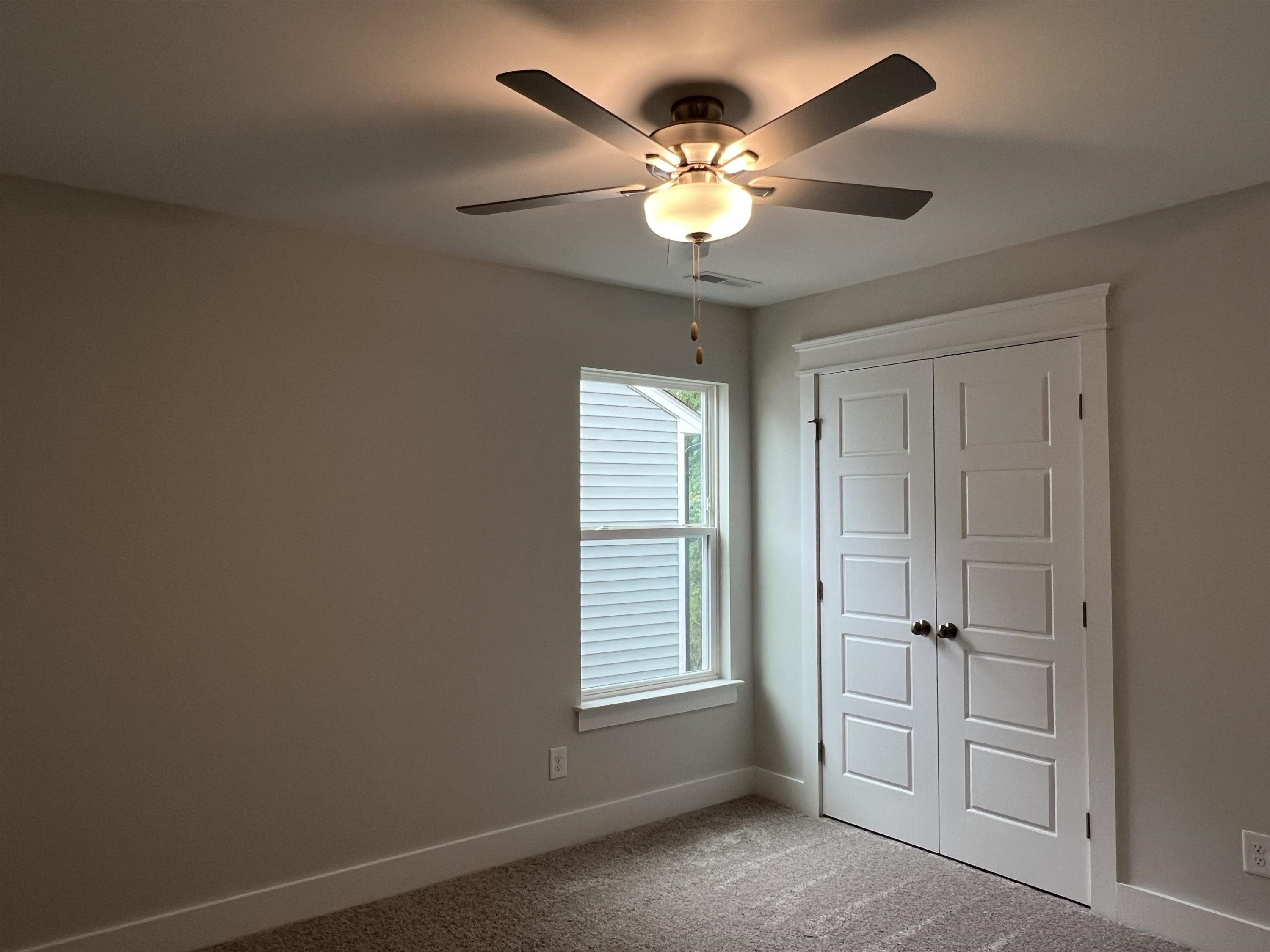 2209 Seneca Road Raleigh, NC 27604 - Photo 18 of 21 a view of an empty room with a window