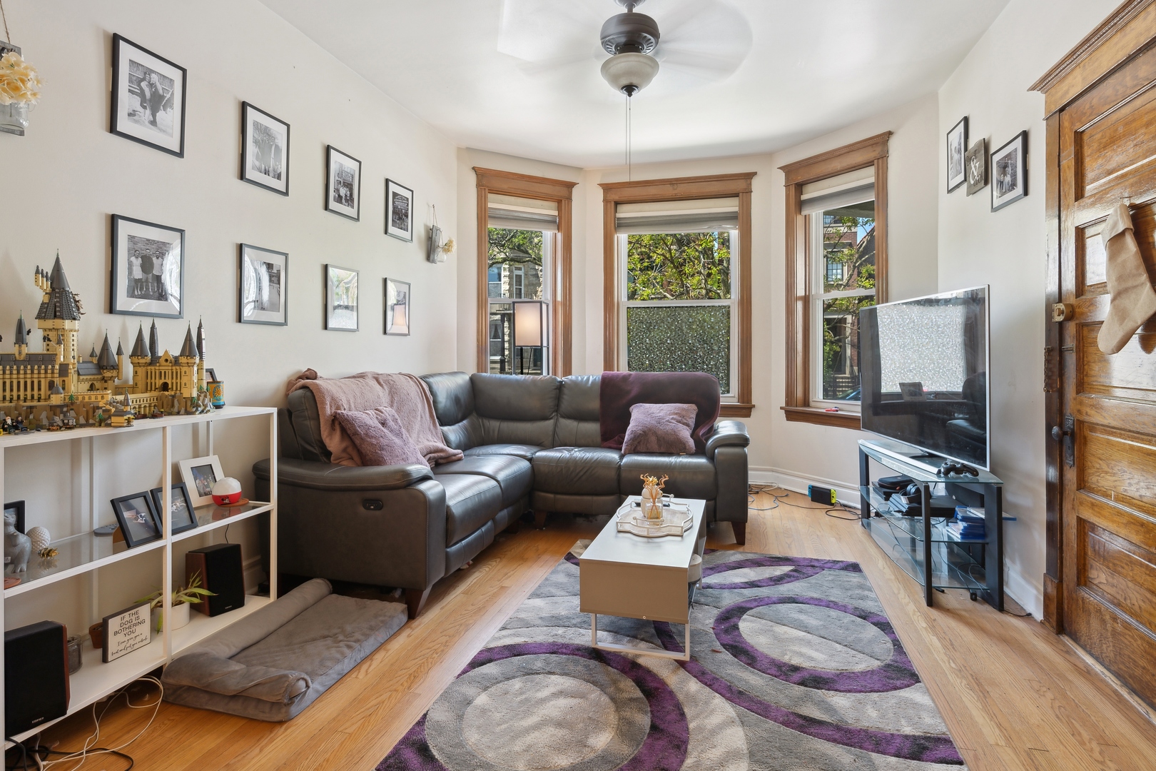 3837 North Lakewood Avenue Chicago, IL 60613 - Photo 11 of 19 a living room with furniture fireplace and flat screen tv