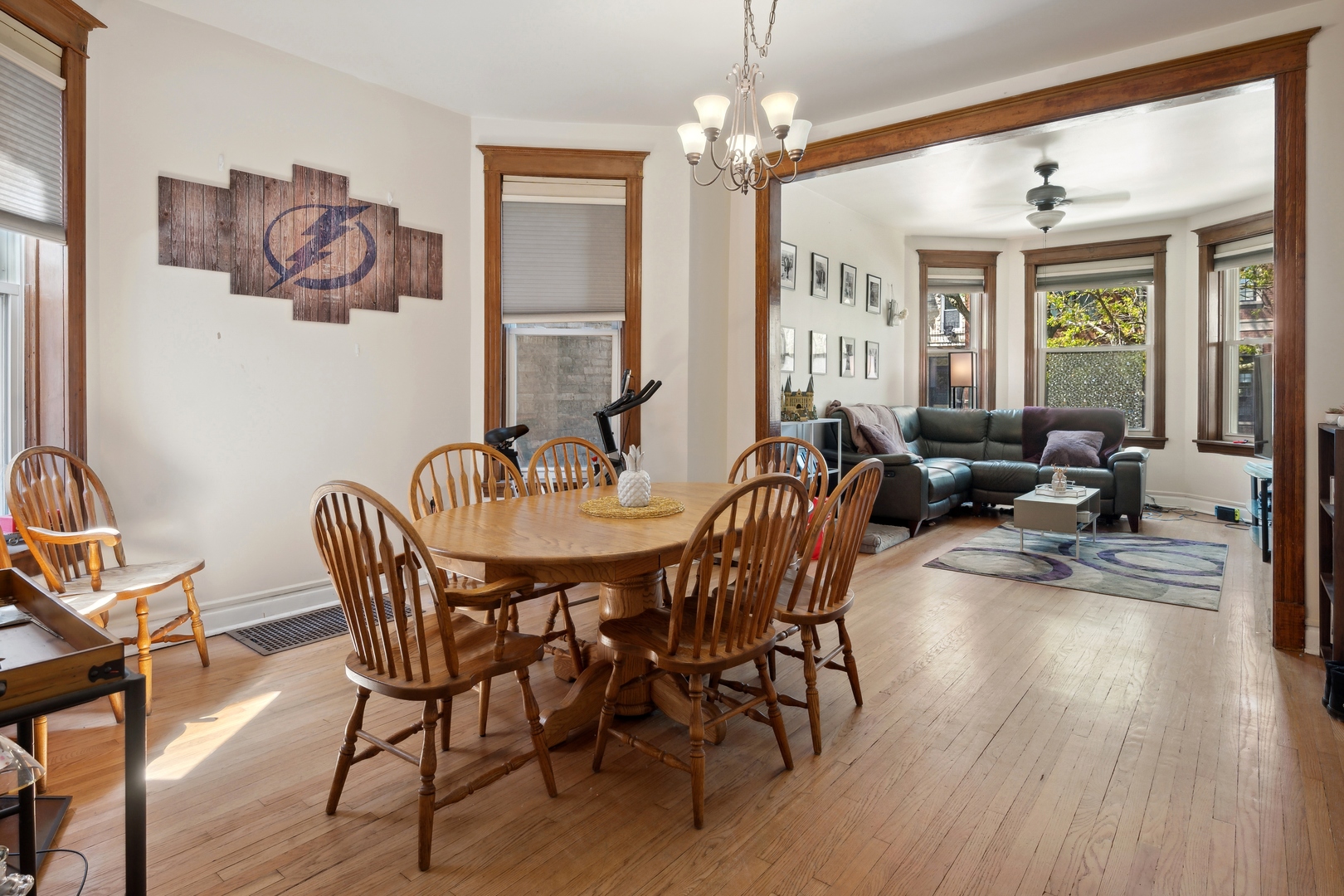 3837 North Lakewood Avenue Chicago, IL 60613 - Photo 12 of 19 a view of a dining room with furniture window and wooden floor