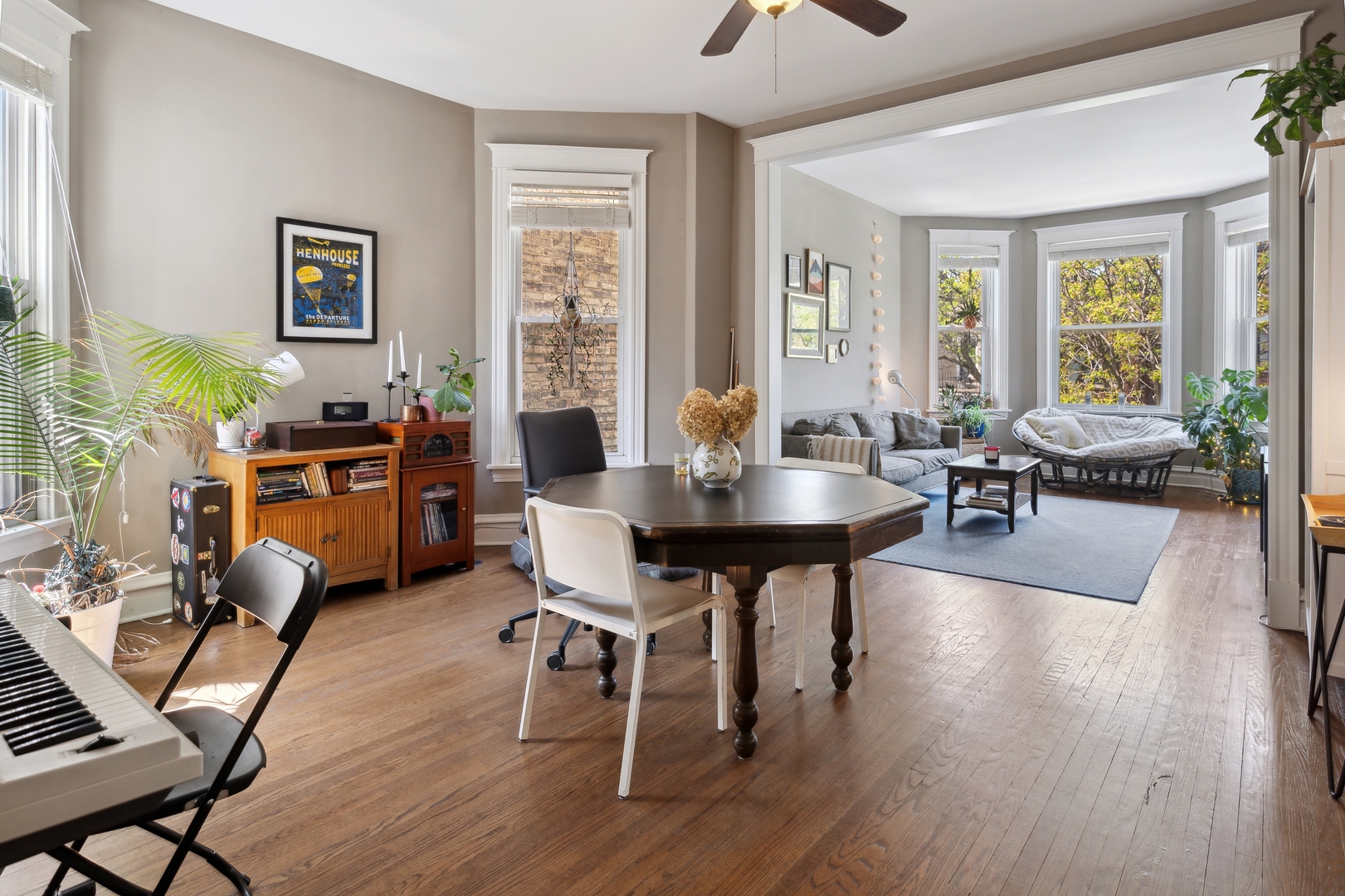 3837 North Lakewood Avenue Chicago, IL 60613 - Photo 3 of 19 a view of a dining room with furniture window and wooden floor