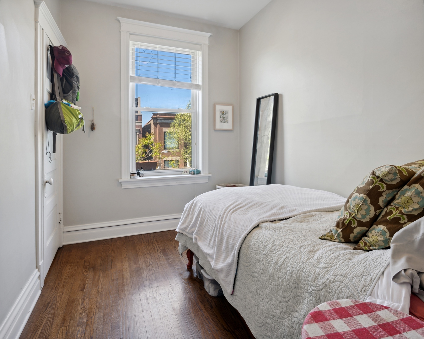 3837 North Lakewood Avenue Chicago, IL 60613 - Photo 9 of 19 a bedroom with a bed and a window