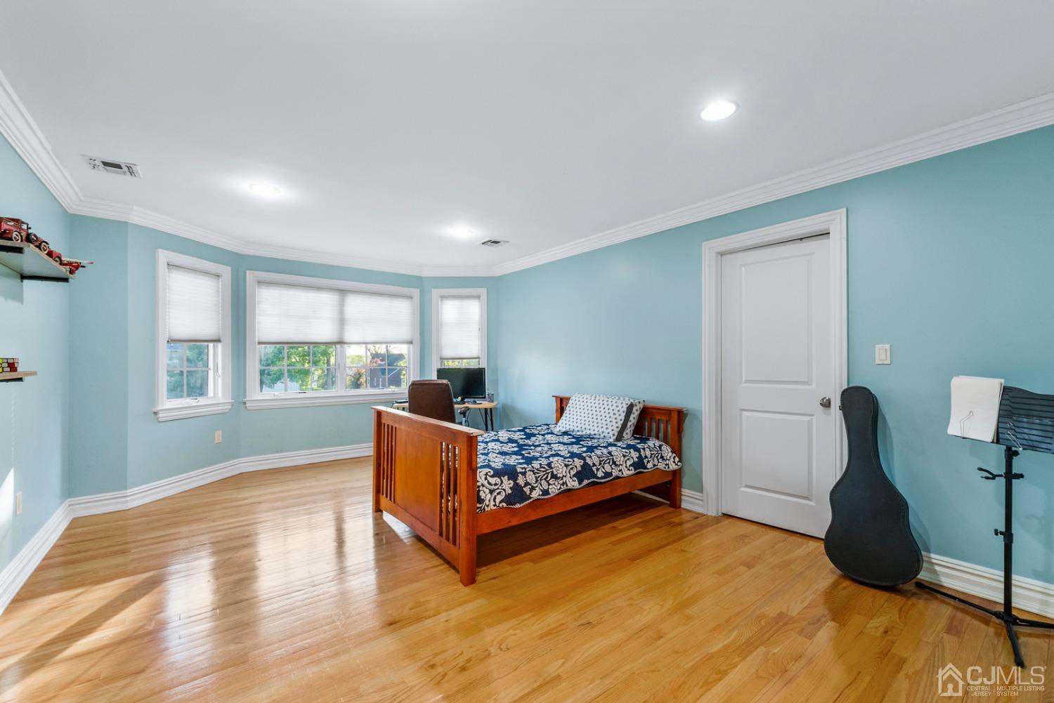 34 Richard Road Edison, NJ 08820 - Photo 44 of 76 a bedroom with furniture and a wooden floor