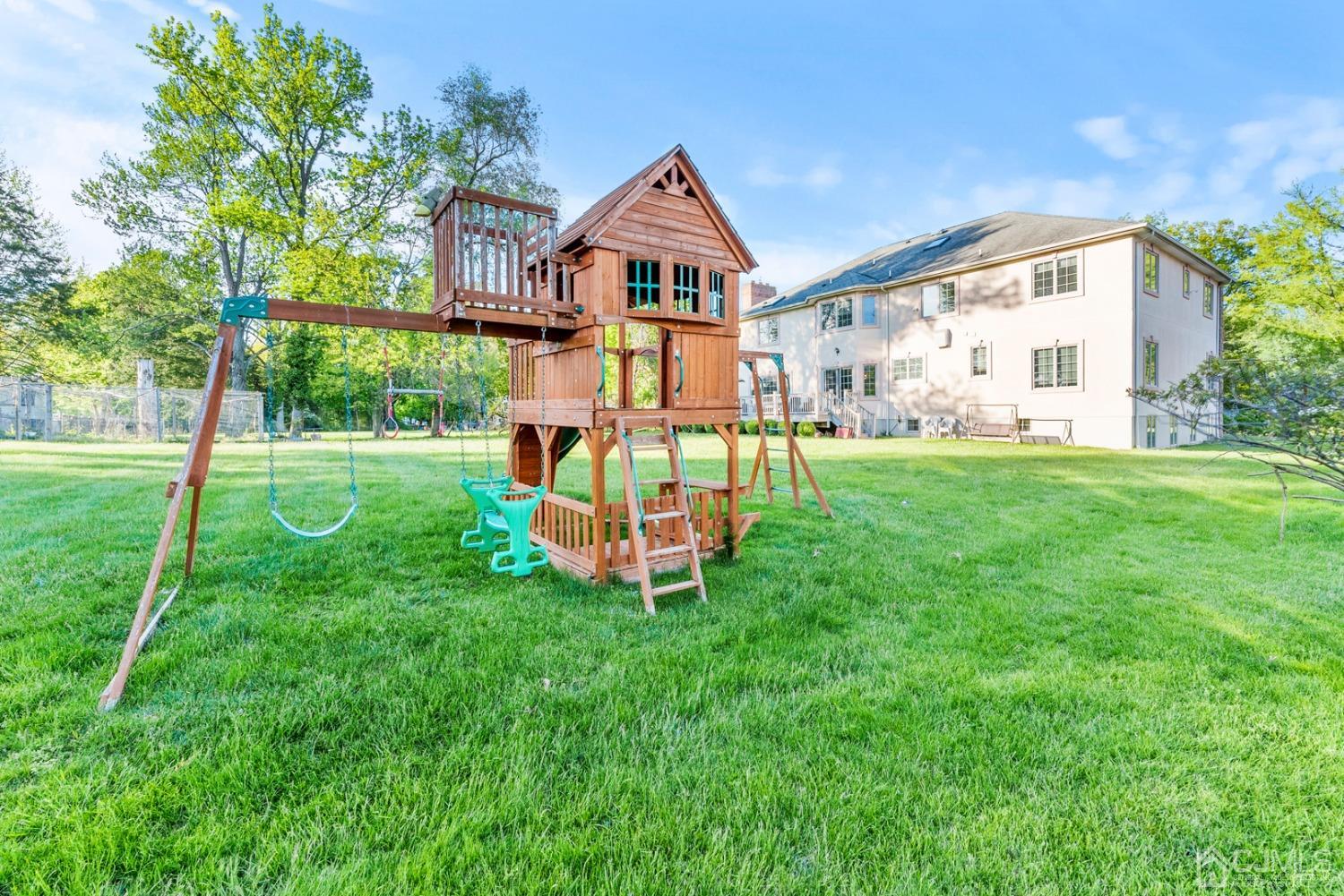 34 Richard Road Edison, NJ 08820 - Photo 68 of 76 a view of a big house with a big yard and large trees