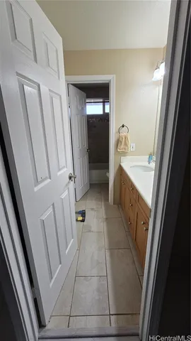 a bathroom with a sink a toilet and a shower