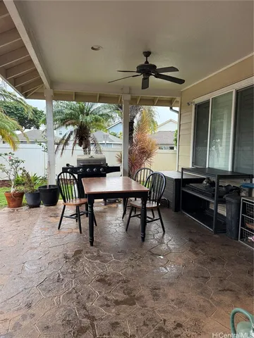a view of a dining table and chairs in patio