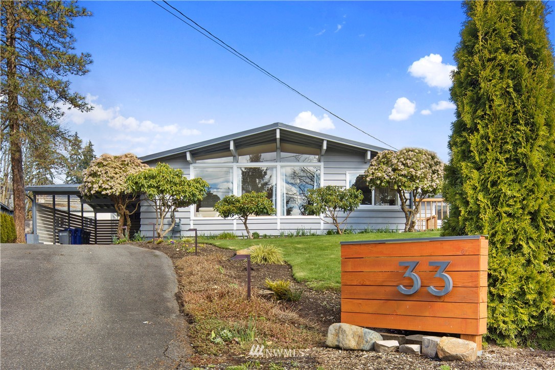 33 243rd Place Southeast Bothell, WA 98021 - Photo 1 of 28 a view of a house with garden and sitting area