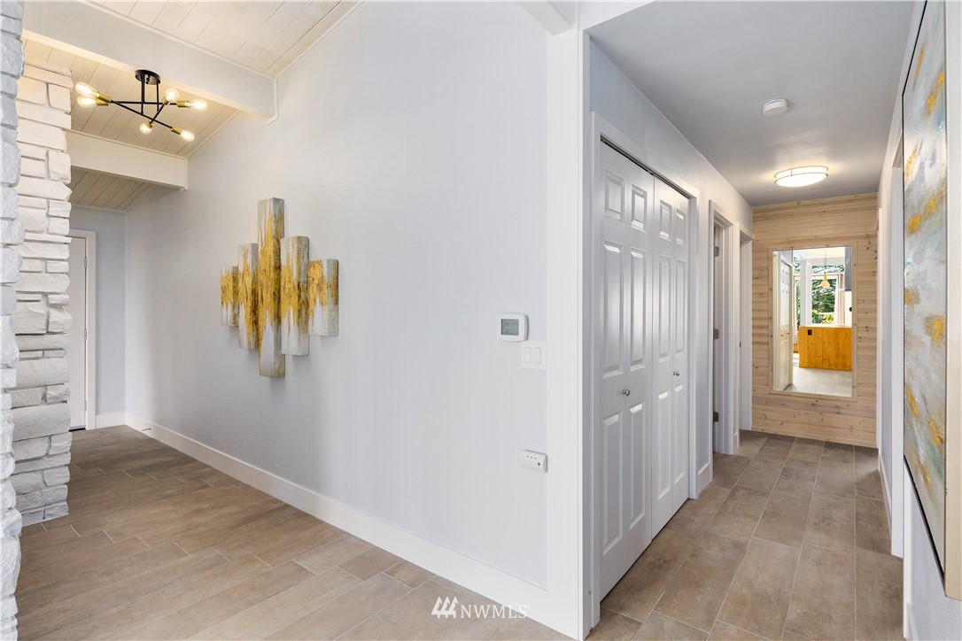 33 243rd Place Southeast Bothell, WA 98021 - Photo 11 of 28 a view of a hallway with wooden floor