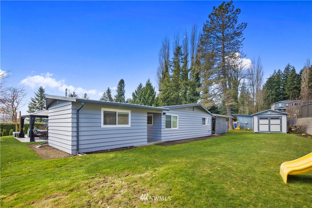 33 243rd Place Southeast Bothell, WA 98021 - Photo 22 of 28 a view of a house with a backyard