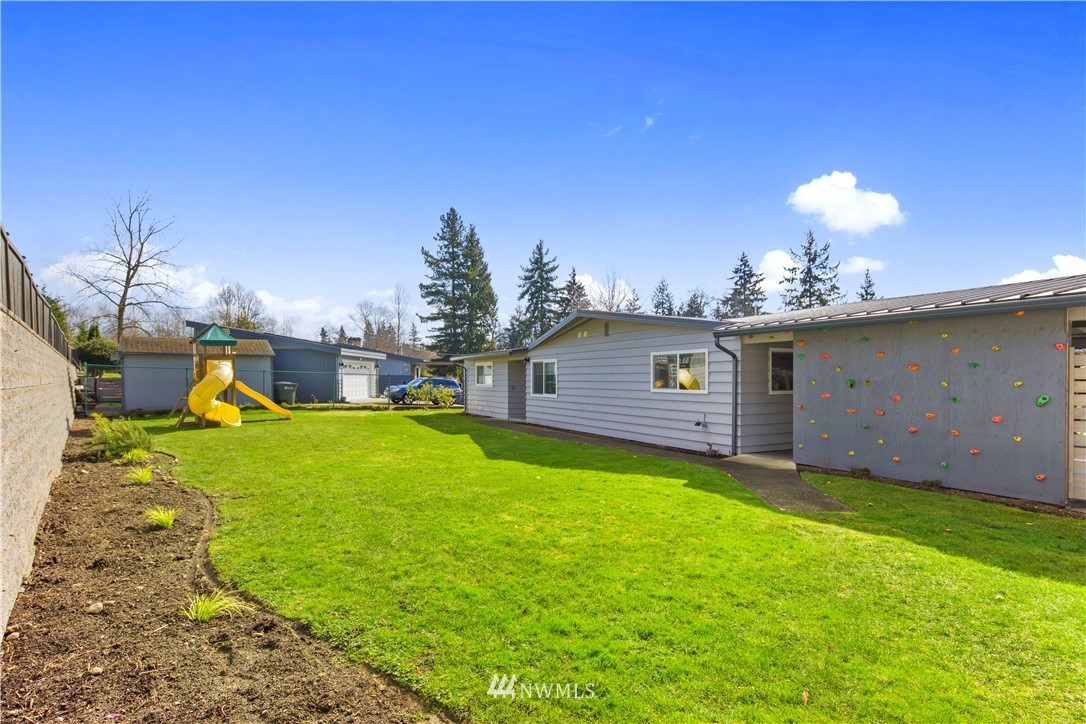 33 243rd Place Southeast Bothell, WA 98021 - Photo 26 of 28 a view of a backyard with a garden