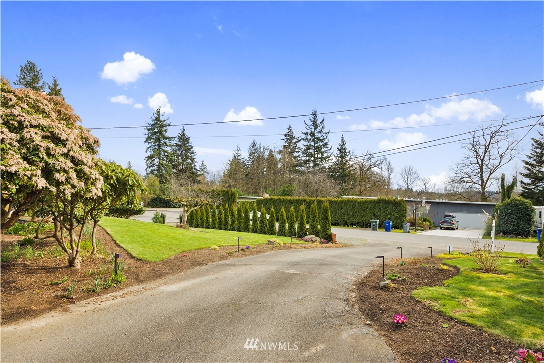 33 243rd Place Southeast Bothell, WA 98021 - Photo 28 of 28 a view of a pathway with a wrought fence