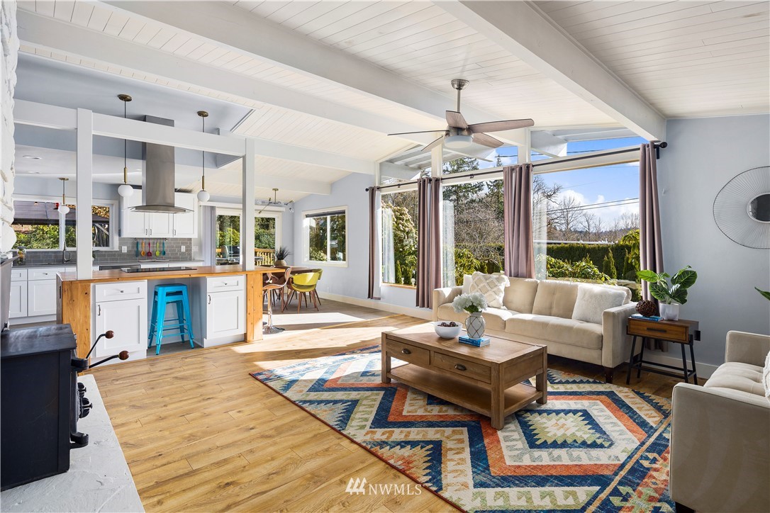33 243rd Place Southeast Bothell, WA 98021 - Photo 4 of 28 a living room with fireplace furniture and a chandelier