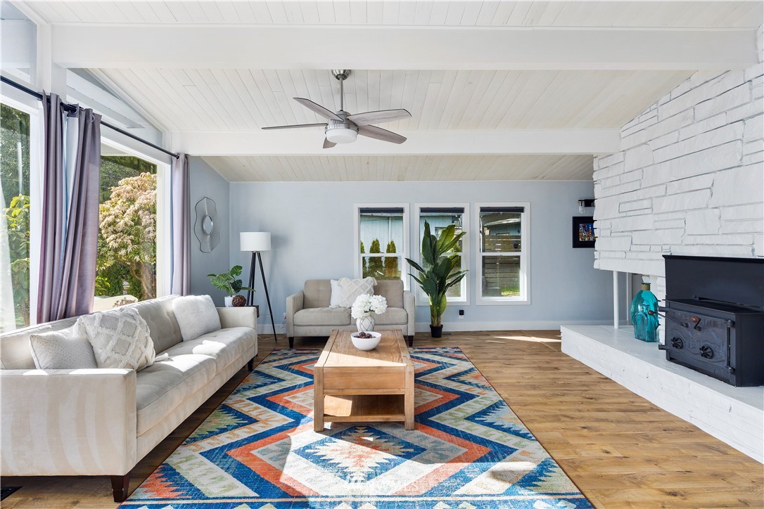 33 243rd Place Southeast Bothell, WA 98021 - Photo 5 of 28 a living room with furniture and a fireplace