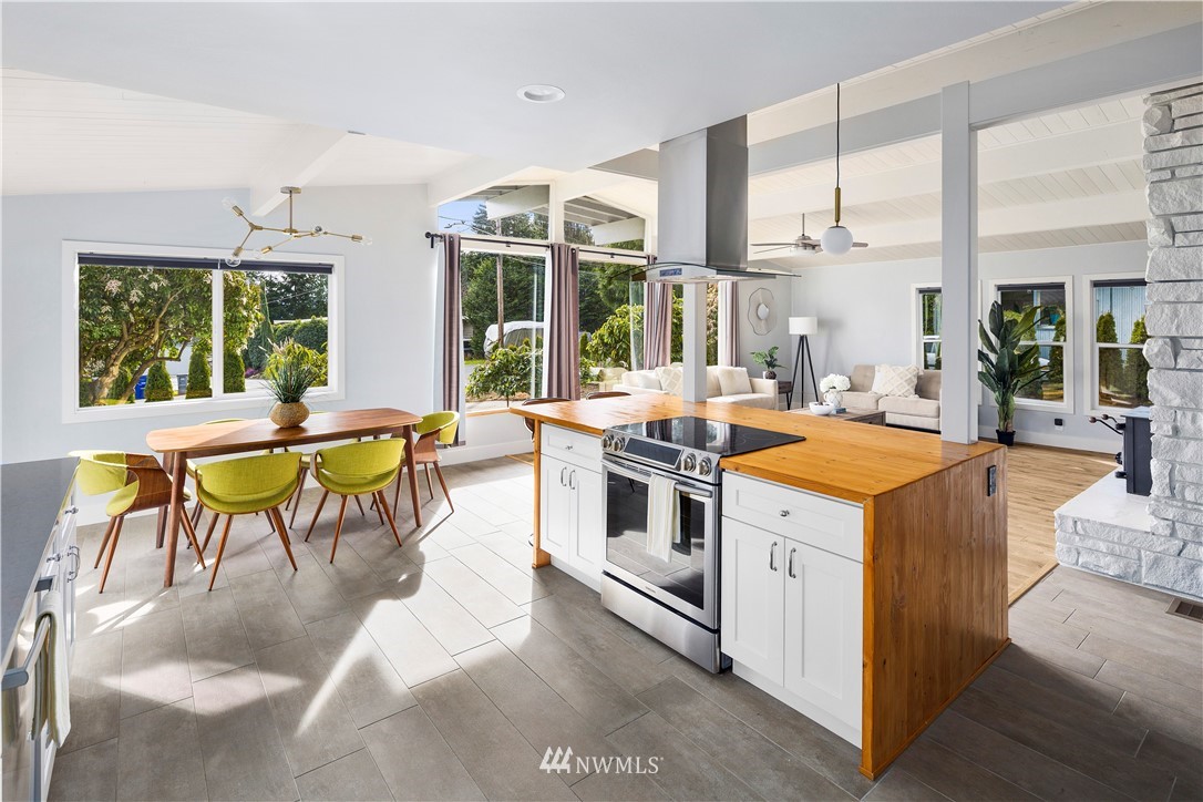 33 243rd Place Southeast Bothell, WA 98021 - Photo 7 of 28 a living room with stainless steel appliances kitchen island granite countertop furniture and a large window