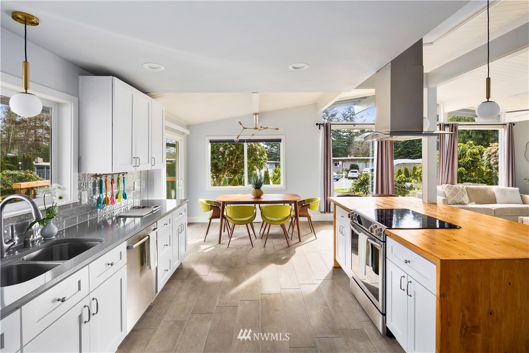 33 243rd Place Southeast Bothell, WA 98021 - Photo 8 of 28 a open kitchen with stainless steel appliances granite countertop a sink and stove