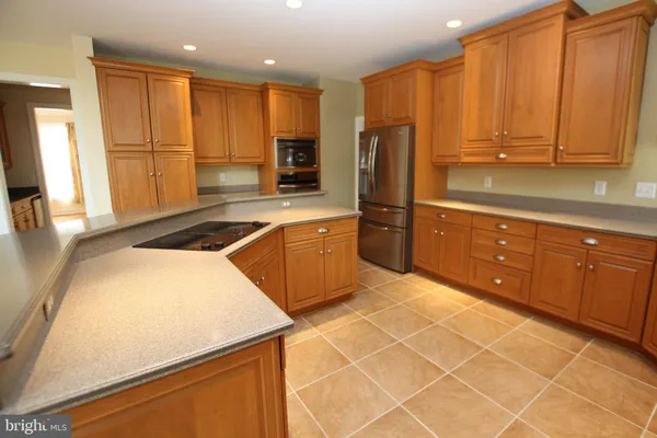 a large kitchen with a large window