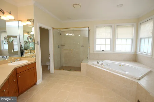 a white toilet sitting next to a shower