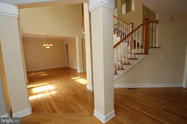a view of entryway with wooden floor