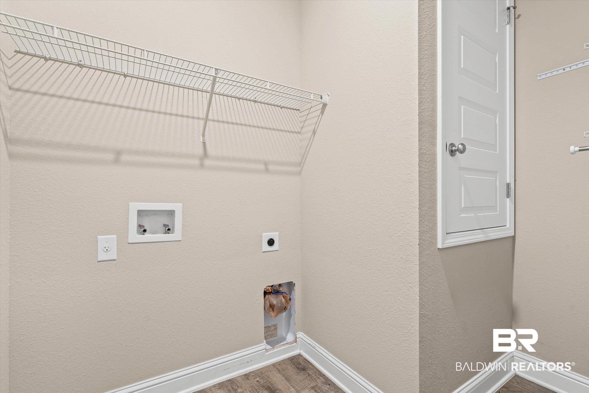 22976 Lieutenant Avenue Foley, AL 36535 - Photo 16 of 30 Laundry area featuring wood finished floors, a textured wall, electric dryer hookup, and hookup for a washing machine