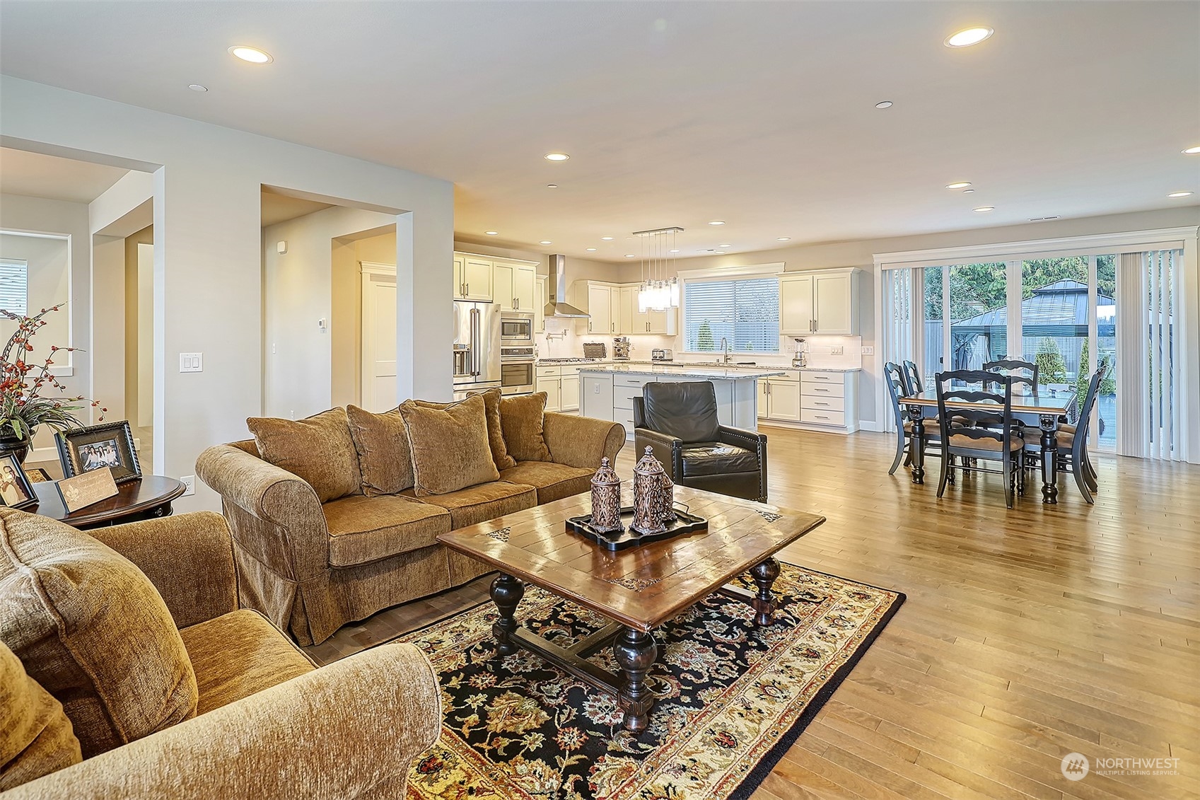 43 242nd Street Southeast Bothell, WA 98021 - Photo 12 of 40 a living room with lots of furniture and a wooden floor