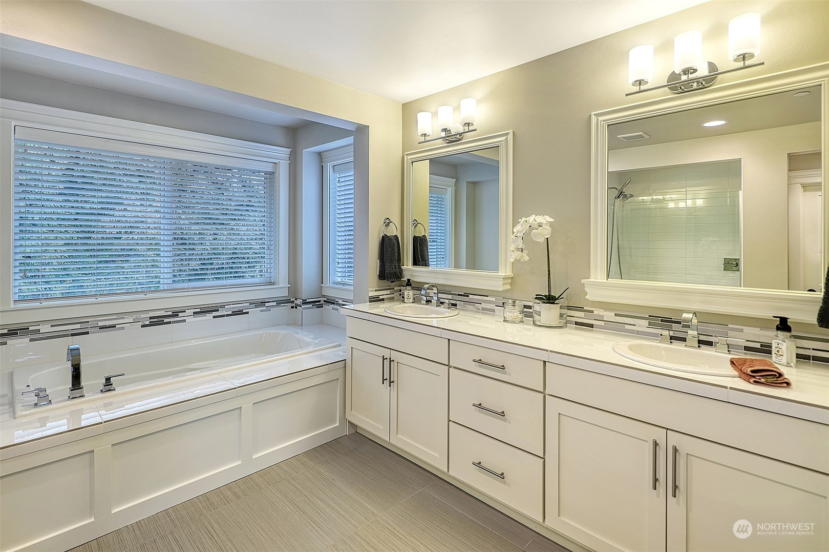 43 242nd Street Southeast Bothell, WA 98021 - Photo 27 of 40 a bathroom with a sink double vanity and a mirror
