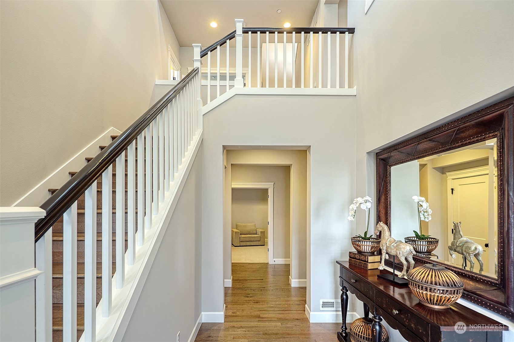 43 242nd Street Southeast Bothell, WA 98021 - Photo 3 of 40 a view of an entryway with wooden floor and stairs