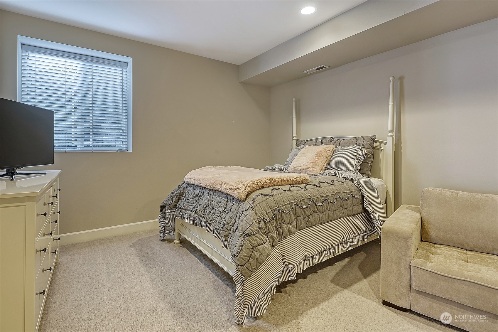 43 242nd Street Southeast Bothell, WA 98021 - Photo 33 of 40 a bedroom with a bed and a flat screen tv