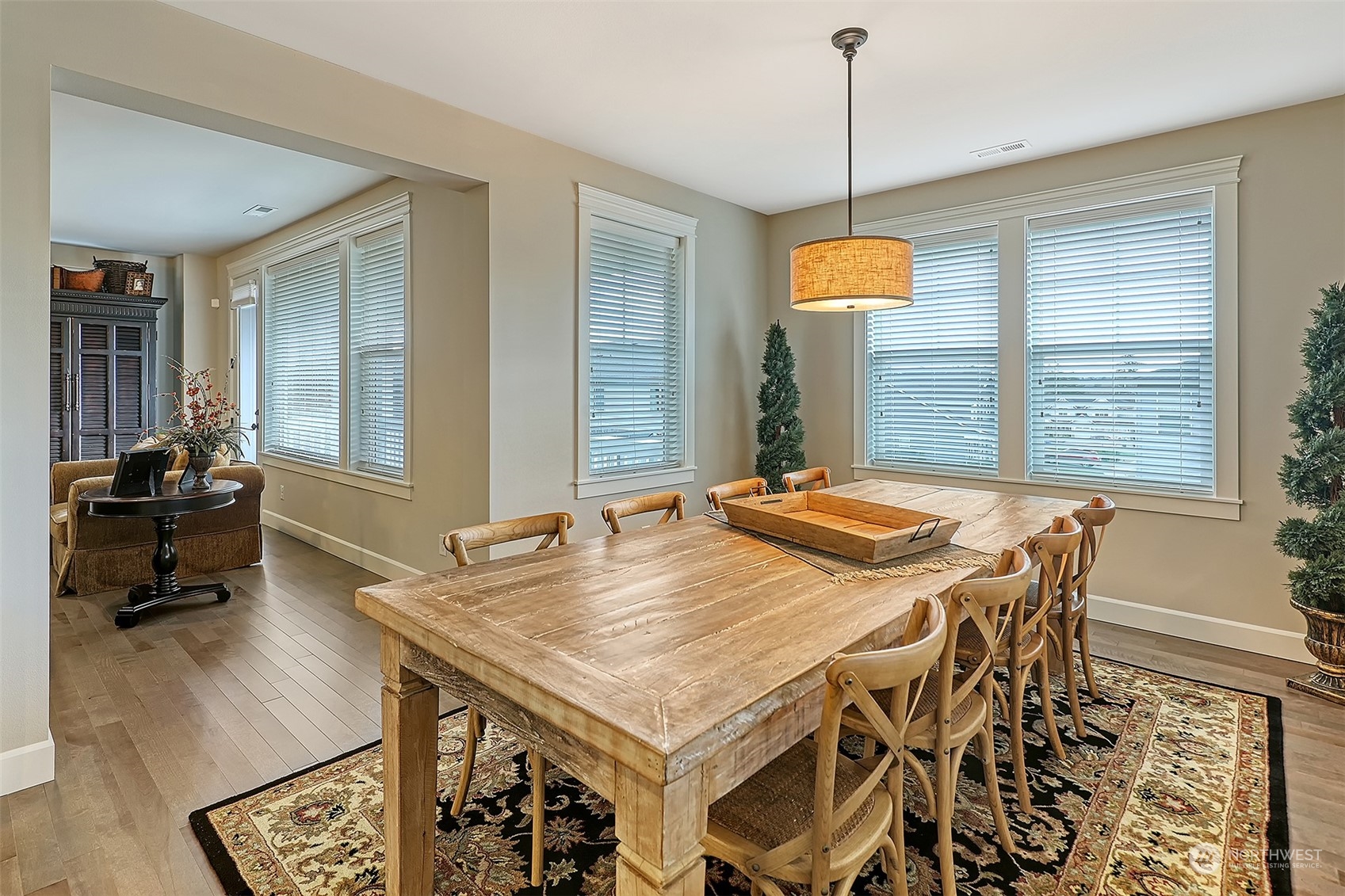 43 242nd Street Southeast Bothell, WA 98021 - Photo 4 of 40 a dining table on the kitchen counter top space and wooden floor