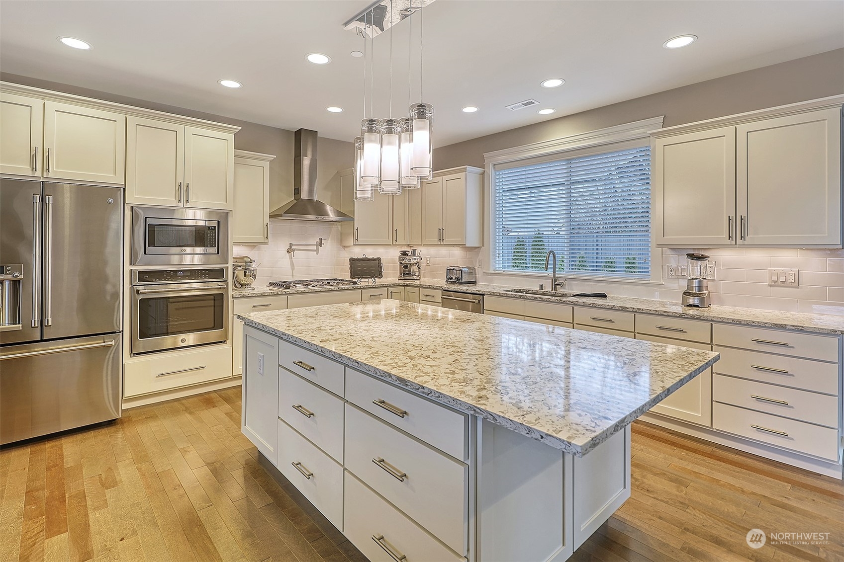 43 242nd Street Southeast Bothell, WA 98021 - Photo 6 of 40 a kitchen with stainless steel appliances granite countertop a sink refrigerator and cabinets