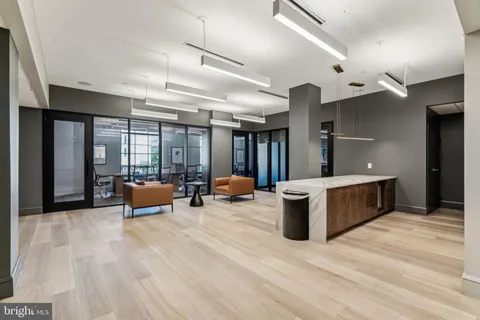 a view of a patio with couple of chairs and a fountain